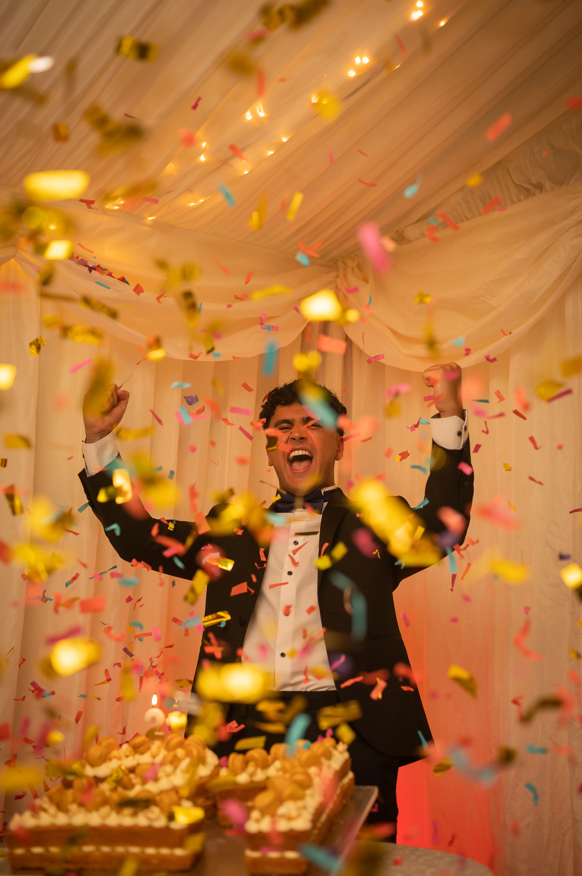 Male with tinsel conveti on his 21st Birthday party