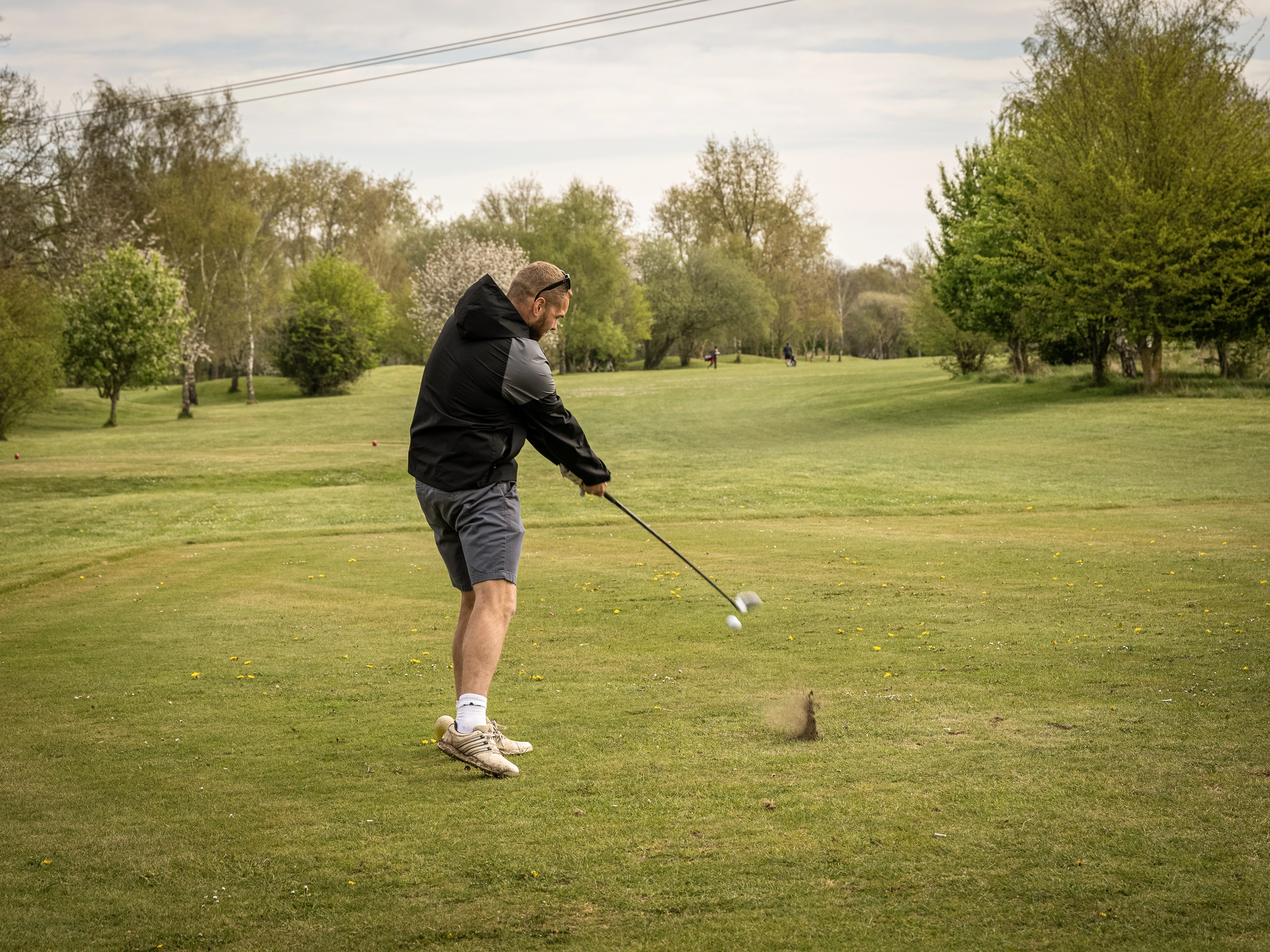 Golf play hitting off towards the green - time flys