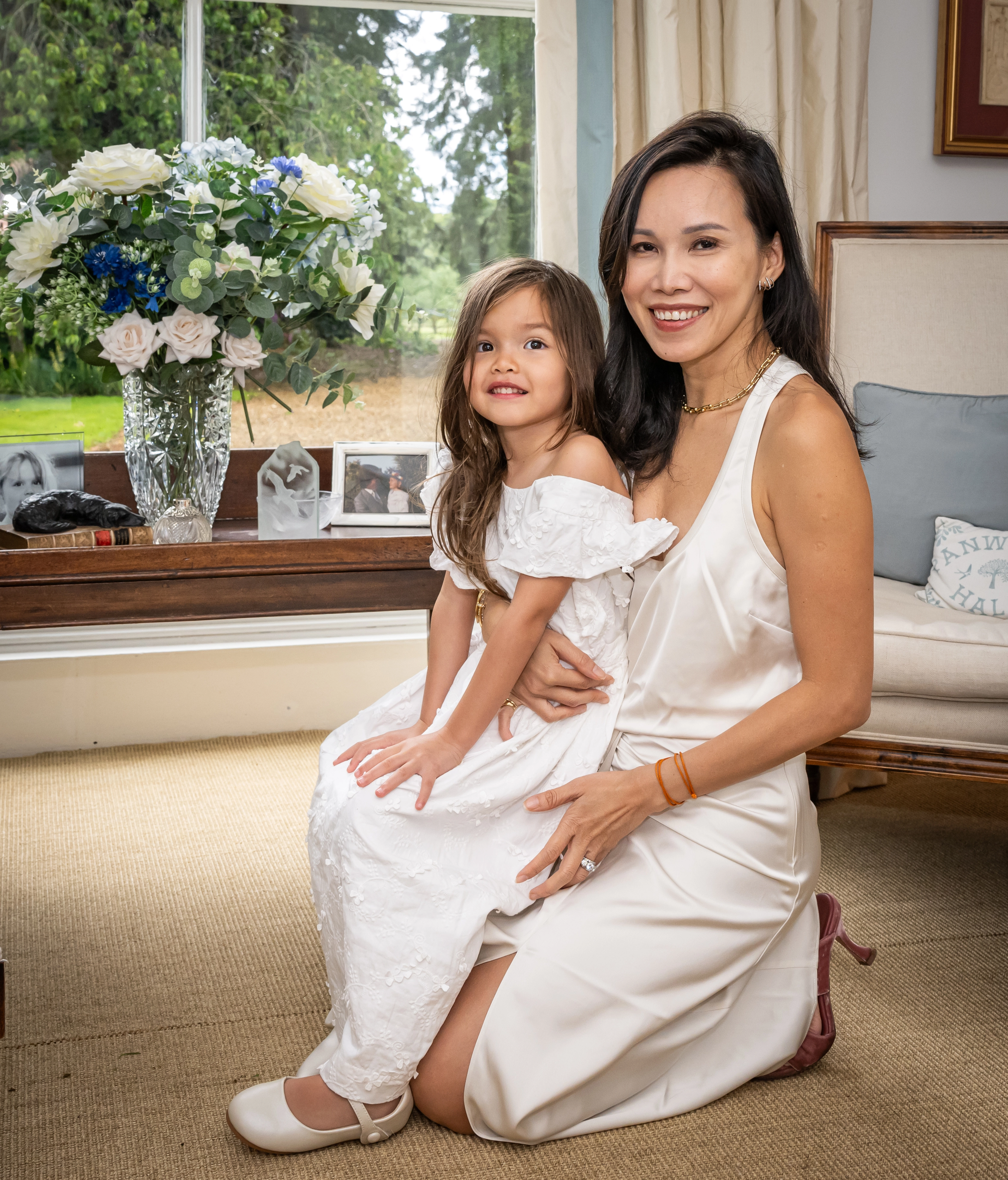 Mummy & Daughter, Dressed in White, Kneeling on floor together